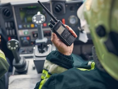 firefighter-holding-walkie-talkie-at-fire-machine.jpg